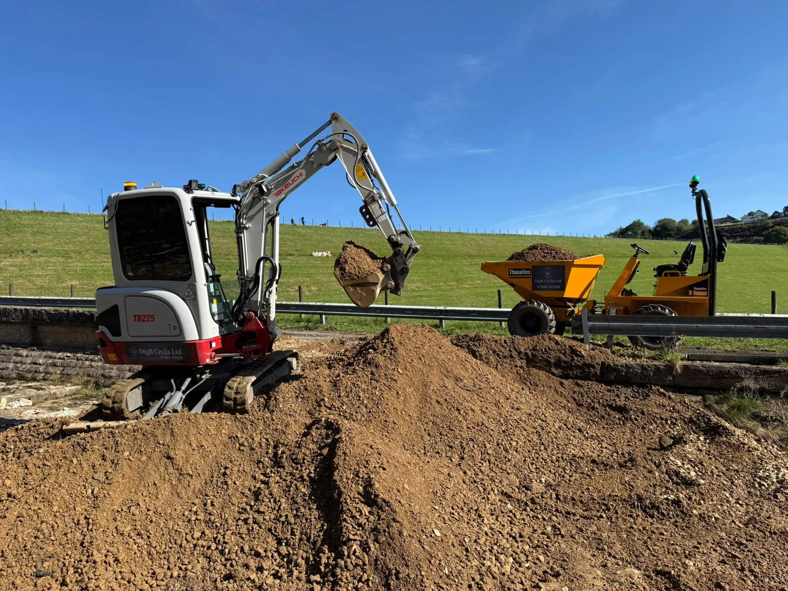DigR Civils excavator and dumper moving soil on a residential site